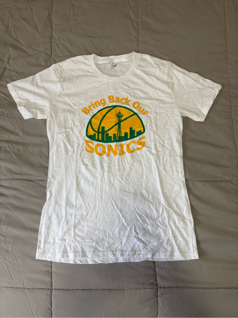 Source Unknown White Tee with Yellow and Green 'Bring Back Our Sonics' Graphic